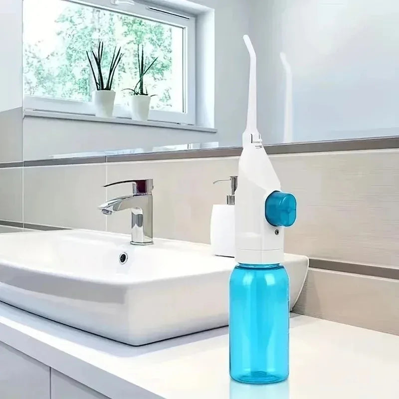183---Portable high-pressure oral irrigator - manual tooth cleaner with grip, nozzle attachment for gum health